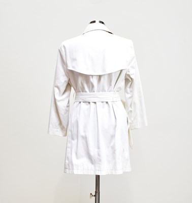 Lot 903 - BURBERRY; a short cream lady's trench coat...