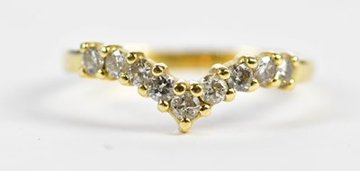 Lot 123 - An 18ct yellow gold and nine stone diamond set...