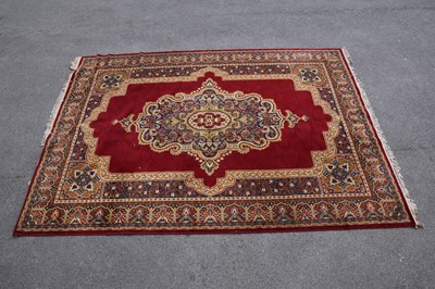 Lot 448 - A red ground machined Tabriz style carpet, 347...