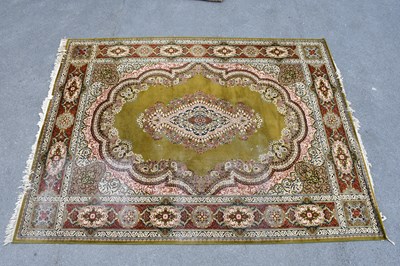 Lot 434 - A large green ground Keshan carpet, 360cm x...