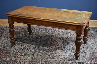 Lot 293 - An old pine kitchen table on turned column...