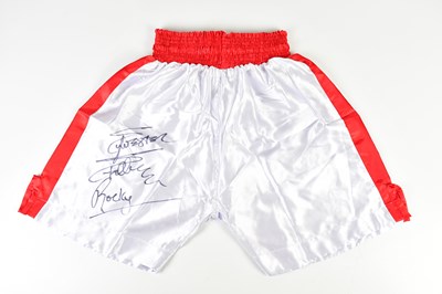 Lot 2363 - SYLVESTER STALLONE; a pair of white and red...