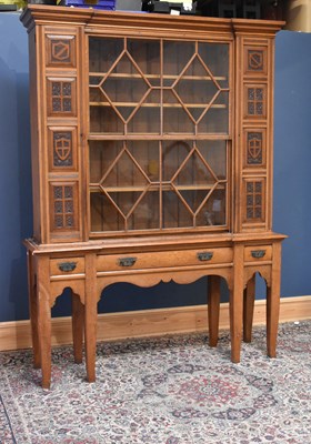 Lot 307 - An Arts & Crafts golden oak high back dresser...