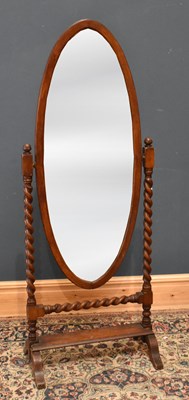 Lot 109 - A 1920s oak cheval mirror with barley twist...