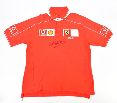 Lot 2394 - MICHAEL SCHUMACHER; a signed Ferrari polo...