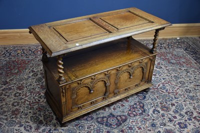 Lot 32 - A carved oak monk's bench with panelled front...
