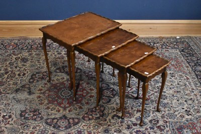 Lot 245 - A 1950s nest of four graduated coffee tables...