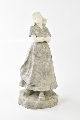 Lot 1184 - A carved alabaster figure of a Dutch girl,...