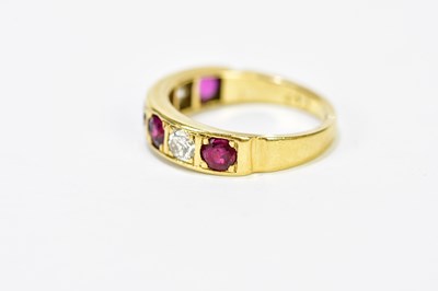 Lot 96 - An 18ct yellow gold five stone ruby and...