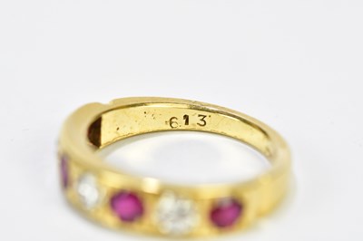 Lot 96 - An 18ct yellow gold five stone ruby and...