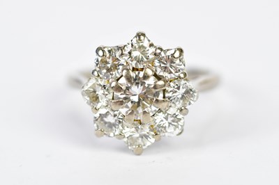 Lot 91 - An 18ct white gold and floral cluster ring,...