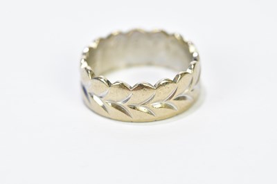 Lot 213 - An 18ct white gold and yellow gold engraved...