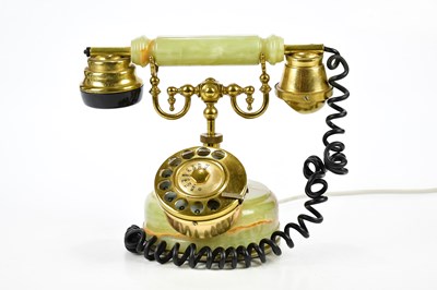 Lot 1095 - A vintage brass and onyx telephone.