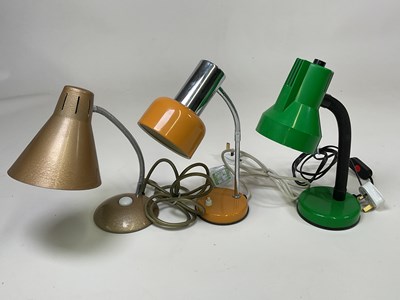 Lot 579 - Three mid 20th century adjustable desk lamps,...