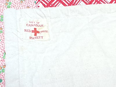 Lot 75 - A vintage Canadian Red Cross patchwork quilt...
