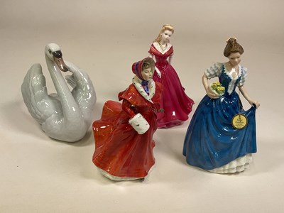 Lot 245 - A collection of ceramic figures, comprising a...