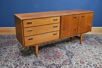 Lot 312 - A mid century teak sideboard with three...