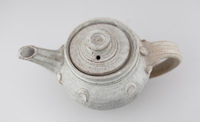 Lot 229 - IAN GODFREY (1942-1992); a stoneware teapot...