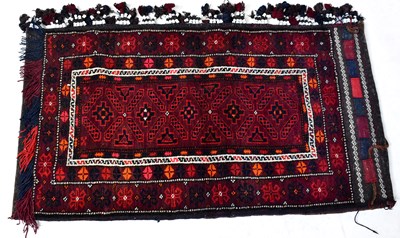 Lot 142 - An Uzbek hand-knotted cushion, in purple, red,...