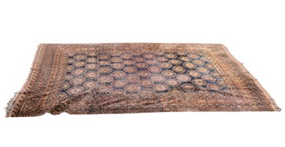 Lot 336 - An Eastern style rust ground carpet, with...