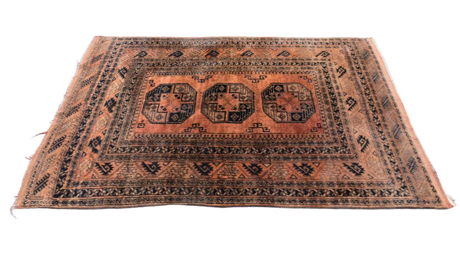 Lot 344 - An Eastern style rug, of orange ground, with