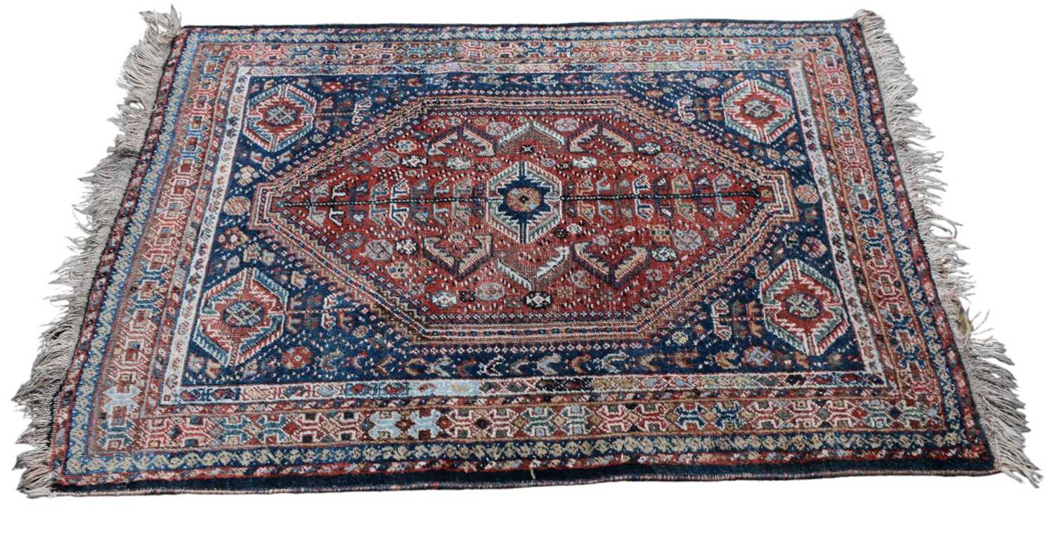 Lot 346 - An Eastern style blue ground rug, with