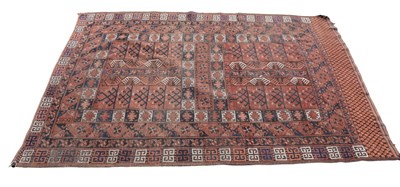 Lot 347 - A red ground Eastern style rug with geometric...