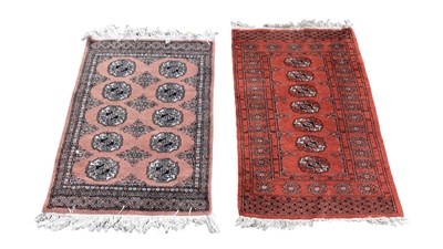 Lot 364 - A red ground Eastern style rug with elephant...