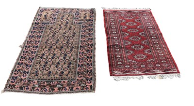 Lot 362 - A red ground Eastern style rug with elephant...