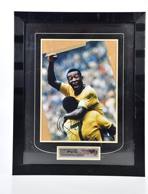 Lot 2290 - PELÉ; an autographed image of Pelé celebrating...