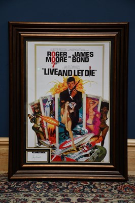 Lot 431 - ROGER MOORE; a framed reproduction poster,...