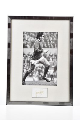 Lot 2301 - GEORGE BEST; a black and white image of George...