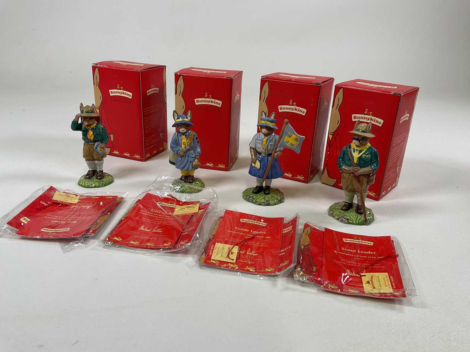 Lot 244 - ROYAL DOULTON BUNNYKINS; four Scout Group...