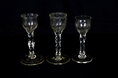 Lot 1472 - Three 19th century wine glasses with faceted...