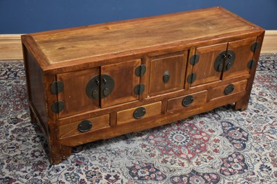 Lot 195 - A 20th century Chinese elm and pine sideboard...