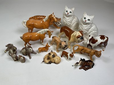 Lot 231 - A group of ceramic figures including Beswick...