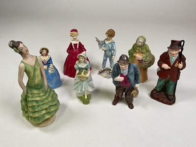 Lot 242 - A group of ceramic figures including Royal...