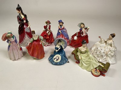 Lot 230 - ROYAL DOULTON; a group of figures including...