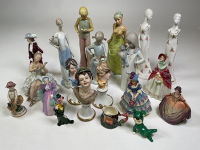 Lot 241 - A group of decorative ceramic figures...