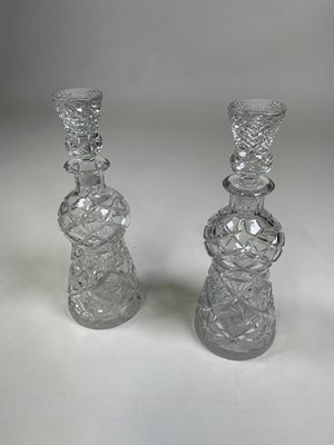 Lot 264 - A pair of cut glass thistle shaped decanters...