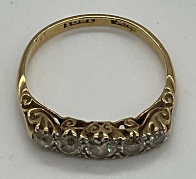 Lot 471 - An Edwardian 18ct yellow gold and five stone...