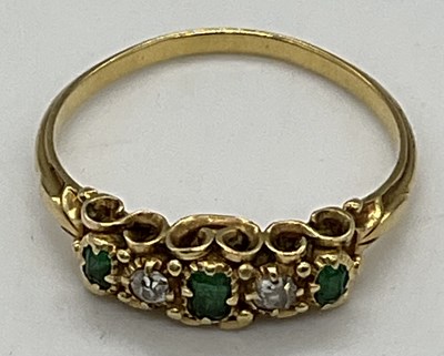 Lot 481 - A yellow metal emerald and diamond five stone...