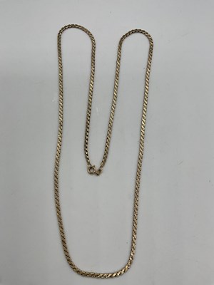 Lot 473 - A 9ct yellow gold flat link long chain, length...