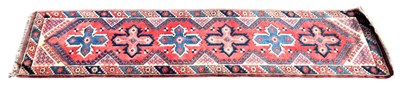 Lot 331 - An antique Turkish runner with stylised motifs...