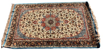 Lot 332 - A Persian designed floral decorated rug with...