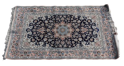 Lot 349 - A Persian designed rug with floral motifs on a...