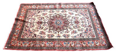 Lot 323 - A Persian designed floral decorated large rug...