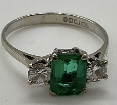 Lot 469 - An 18ct white gold emerald and diamond ring,...