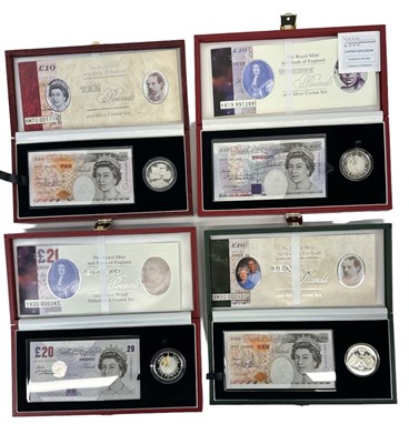 Lot 822 - THE ROYAL MINT; two cased five pound silver...