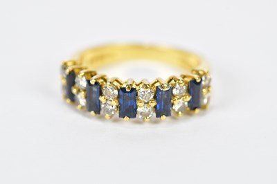 Lot 126 - An 18ct yellow gold sapphire and diamond ring...